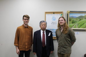From left to right: Alex, Wazuka Town Mayor Hori-san, Justin. They stand next to each other taking a commemorative portrait.