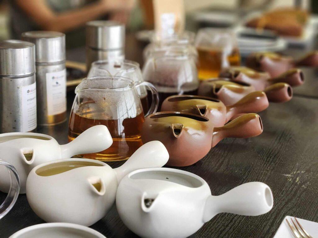Closeup of the many kyusu in use at the tea tasting