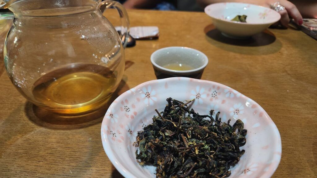 The dried completed tea along with the first brew