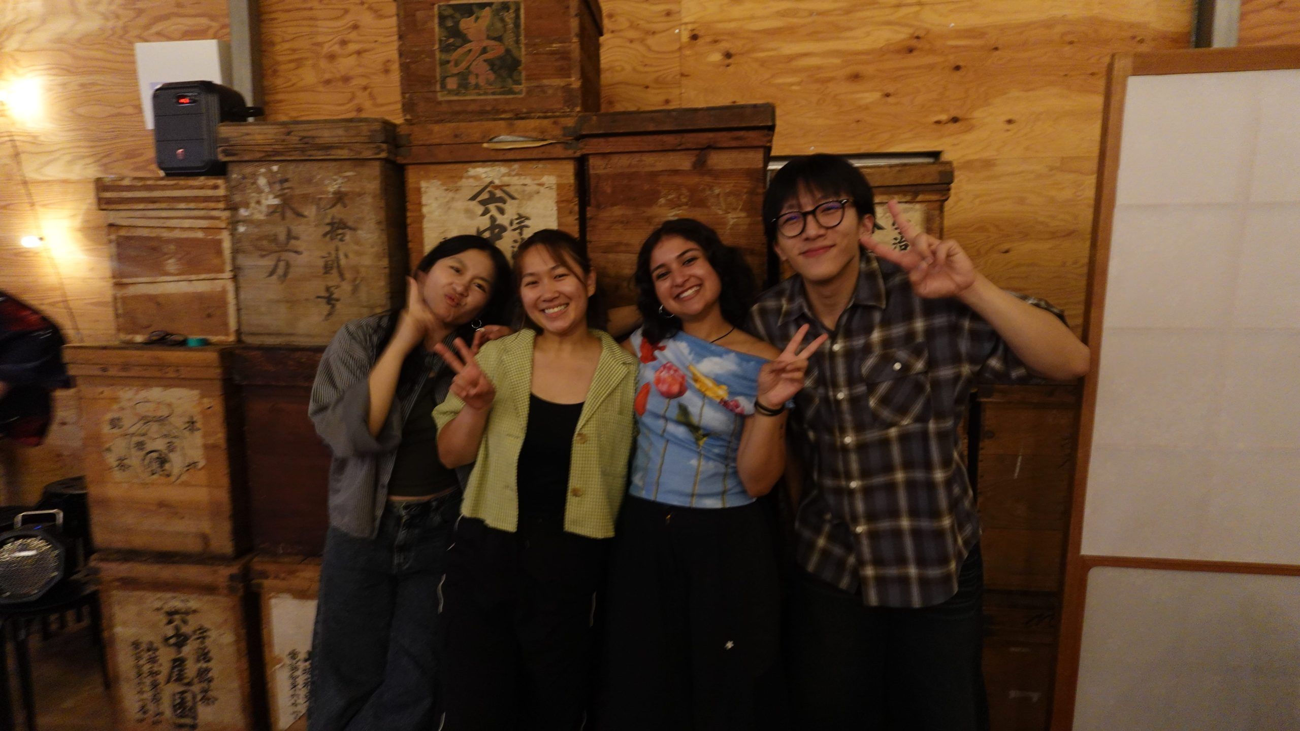 Monica, Tran, Dhvani, and David posing infront of large chabakos.